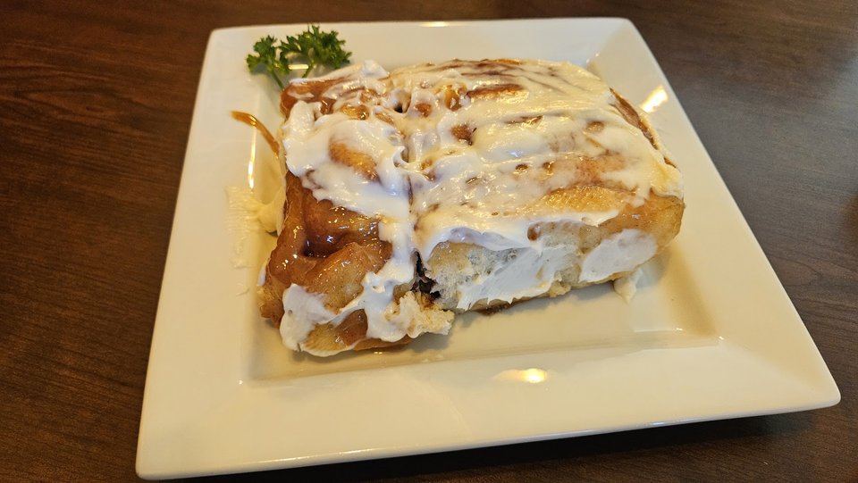 Breakfast dishes served on classic white plates.