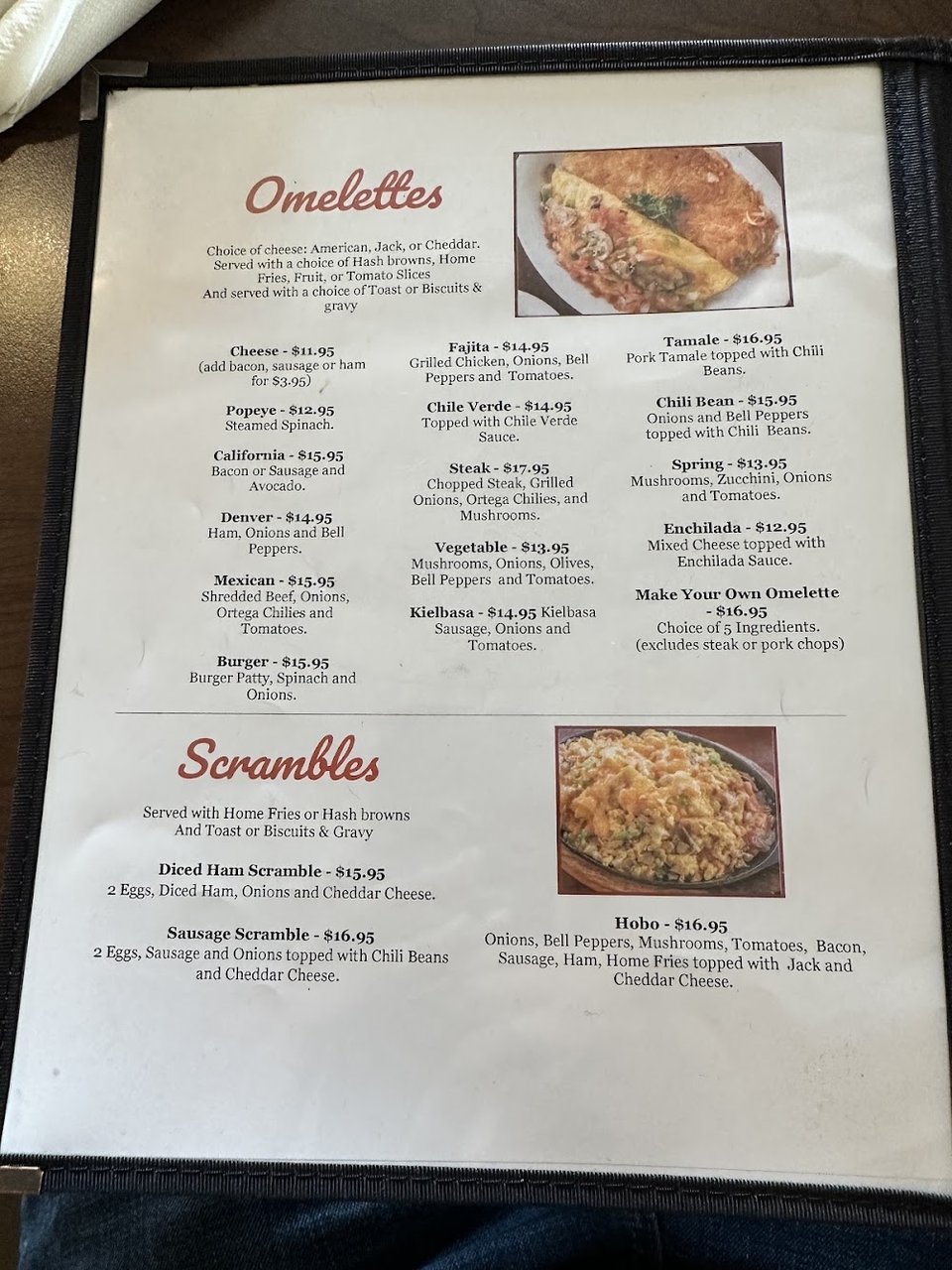 Printed breakfast menu with omelettes and combos.